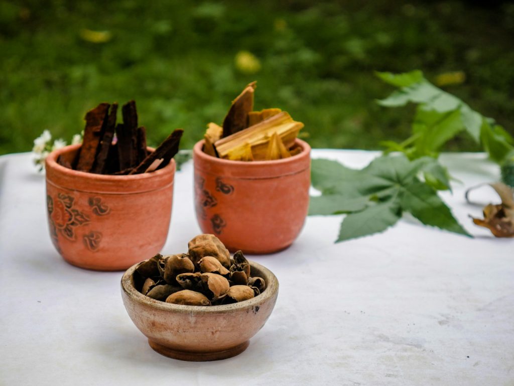 a couple of bowls filled with nuts on top of a table